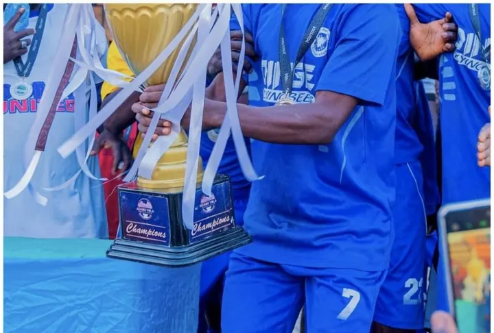 Players holding the Unity Cup trophy